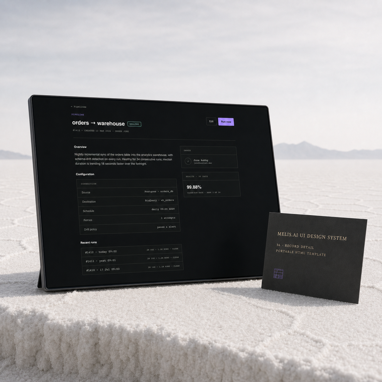 The shipped orders-to-warehouse record-detail interface runs on a slim charcoal display on a white salt plain, beside a thin card identifying template 36, Record Detail